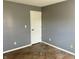 Empty bedroom with gray walls and tile floor at 7254 Broyles Ln, Indianapolis, IN 46217