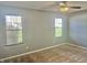 Bright bedroom with neutral walls, carpet, and two large windows at 7254 Broyles Ln, Indianapolis, IN 46217