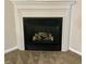 Corner gas fireplace with modern mantel at 7254 Broyles Ln, Indianapolis, IN 46217