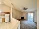 Living room with corner fireplace and access to kitchen at 7254 Broyles Ln, Indianapolis, IN 46217