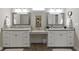 Double vanity bathroom with modern white cabinets and gray countertops at 107 Woodview Dr, Pittsboro, IN 46167