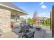 Relaxing patio with fire pit, seating, and a covered area at 107 Woodview Dr, Pittsboro, IN 46167