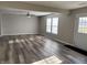 Living room featuring ceiling fan and door to backyard at 10731 Crackling Dr, Indianapolis, IN 46259