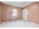 Simple bedroom with neutral walls, carpet, and a double door closet at 10787 Pimlico Cir, Carmel, IN 46280