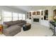 Cozy Gathering room featuring built-in shelving and a fireplace at 12540 Sandstone Run, Carmel, IN 46033