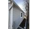 Side of gray house with a chain link fence at 1510 E Gimber St, Indianapolis, IN 46203