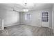 Spacious living room with hardwood floors and chandelier at 3331 Graceland Ave, Indianapolis, IN 46208