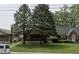 Two-story house with a yard and neighboring houses visible at 3949 English Ave, Indianapolis, IN 46201