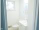 Clean bathroom with white vanity and a large mirror at 4001 N Catherwood Ave, Indianapolis, IN 46226