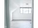 Bright bedroom with gray vinyl flooring and a large window at 4001 N Catherwood Ave, Indianapolis, IN 46226