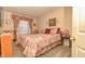 Cozy bedroom with floral bedding and a wall-mounted TV at 5769 Arlington Dr, Plainfield, IN 46168