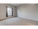 Simple bedroom with large window and neutral decor at 6420 Hunters Green Ct, Indianapolis, IN 46278