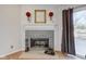 Modern fireplace with gray stone surround and decorative mantel at 6420 Hunters Green Ct, Indianapolis, IN 46278