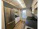 Stainless steel refrigerator and white cabinets in kitchen at 7416 Countrybrook Dr # 7416, Indianapolis, IN 46260