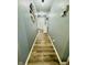 Gray hallway with wood-look flooring, leading to the front door at 8045 Retreat Ln, Indianapolis, IN 46259