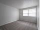 Simple bedroom with gray carpet and window at 8104 Wallingwood Dr, Indianapolis, IN 46256