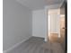 Bedroom with gray carpet and access to hallway at 8104 Wallingwood Dr, Indianapolis, IN 46256