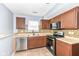 Bright kitchen with stainless steel appliances and tile backsplash at 9122 Bagley Dr, Indianapolis, IN 46231