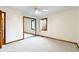 Bedroom with mirrored closet doors, window, and ceiling fan at 995 E 256Th St, Sheridan, IN 46069