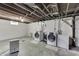 Unfinished basement with washer, dryer, and dehumidifier at 1029 E Jefferson St, Franklin, IN 46131