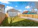 Large backyard with gravel area and wooden fence at 1101 W Roache St, Indianapolis, IN 46208