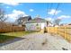 Spacious backyard with gravel area and wooden fence at 1101 W Roache St, Indianapolis, IN 46208
