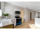 Modern kitchen with white cabinets and stainless steel appliances at 1101 W Roache St, Indianapolis, IN 46208