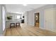 Modern kitchen features white cabinets, stainless steel appliances, and a breakfast bar at 1101 W Roache St, Indianapolis, IN 46208
