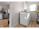 Convenient laundry room with washer, dryer, and cabinets at 1101 W Roache St, Indianapolis, IN 46208