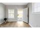 Bright and airy living room with light flooring and neutral walls at 1101 W Roache St, Indianapolis, IN 46208