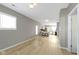 Open concept living room with hardwood floors and kitchen access at 1101 W Roache St, Indianapolis, IN 46208