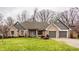 Brick home with gray accents, 2-car garage, and landscaped lawn at 11624 Horizon Ct, Fishers, IN 46037