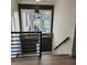 Modern staircase with sleek metal railing and wood flooring at 11624 Horizon Ct, Fishers, IN 46037