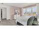 Bedroom with blush walls, white dresser, and large windows at 1500 Chatham Village Blvd, Westfield, IN 46074