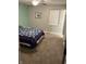 Bright bedroom with carpeted floor and a queen bed at 1501 Ashley Dr, Lebanon, IN 46052