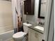 Clean bathroom with a shower/tub combo and granite countertop at 1513 Laurel Dr, Columbus, IN 47203