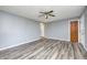 Living room with hardwood floors and ceiling fan at 1641 Manhattan Ave, Indianapolis, IN 46241