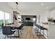 Open concept dining room with wooden table and modern chairs at 19717 Patcham Rd, Westfield, IN 46074