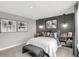 Modern bedroom with gray walls and artwork above the bed at 20259 Chad Hittle Blvd, Westfield, IN 46074