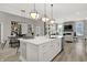 Modern kitchen with large island, white cabinets and stainless steel appliances at 20259 Chad Hittle Blvd, Westfield, IN 46074