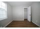 Bedroom with hardwood floors, window, and closet at 2217 E 34Th St, Indianapolis, IN 46218