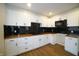 Modern kitchen featuring white cabinets and wood countertops at 2217 E 34Th St, Indianapolis, IN 46218