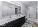 Double vanity bathroom with dark cabinets and a shower/tub combo at 2539 Shadowbrook Trce, Greenwood, IN 46143