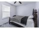 Bedroom with leopard print comforter and dark wood frame bed at 2539 Shadowbrook Trce, Greenwood, IN 46143