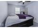 Bedroom with purple comforter and a built-in dresser at 2539 Shadowbrook Trce, Greenwood, IN 46143
