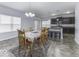 Kitchen and dining area with dark cabinets and a tile floor at 2539 Shadowbrook Trce, Greenwood, IN 46143