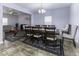 Open dining room with large table and chairs, and view of living room at 2539 Shadowbrook Trce, Greenwood, IN 46143