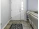 Bright entryway with a white door, tile floor, and area rug at 2539 Shadowbrook Trce, Greenwood, IN 46143