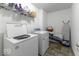 Convenient laundry room with washer, dryer, and shelving at 2539 Shadowbrook Trce, Greenwood, IN 46143