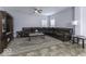 Spacious living room featuring a large sectional sofa and tile floors at 2539 Shadowbrook Trce, Greenwood, IN 46143